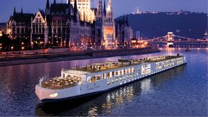 Viking cruise boat on a river at night